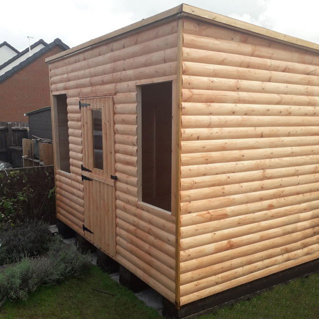 Pent loglap shed